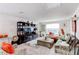 Upstairs entertainment area with comfortable seating, a large TV, and stylish decor for relaxing at 230 Mackenzie Ct, Covington, GA 30016