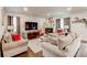 Inviting living room featuring a cozy fireplace, comfortable seating, and stylish decor at 230 Mackenzie Ct, Covington, GA 30016