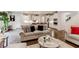 Open-concept living space with a view of the modern kitchen, showcasing a seamless flow for everyday living at 230 Mackenzie Ct, Covington, GA 30016