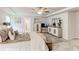 Bright and airy bedroom features a decorative rug, tray ceilings, and stylish furniture at 230 Mackenzie Ct, Covington, GA 30016