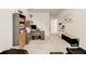 Versatile home office space featuring ample storage, a desk area, and room for exercise equipment at 230 Mackenzie Ct, Covington, GA 30016