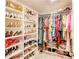 Organized walk-in closet features shelves and racks for storing shoes, clothing, and accessories at 230 Mackenzie Ct, Covington, GA 30016