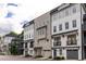 Beautiful townhouse row featuring multi-story buildings, private garages, and architectural details at 24 Becker Nw Pl, Atlanta, GA 30307
