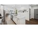 Spacious kitchen with a center island and stainless steel appliances, connecting to the living area at 24 Becker Nw Pl, Atlanta, GA 30307