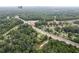 View of the neighborhood with mature trees, and the surrounding business area visible nearby at 2552 Scenic S Hwy, Snellville, GA 30078
