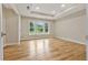 A bedroom with hardwood floors and large windows providing ample natural light at 2552 Scenic S Hwy, Snellville, GA 30078