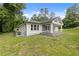 Charming exterior with gray and white siding, a welcoming front porch, and a lush green lawn at 2552 Scenic S Hwy, Snellville, GA 30078
