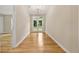 Bright hallway featuring hardwood floors and a view of the backyard through glass doors at 2552 Scenic S Hwy, Snellville, GA 30078