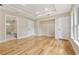 A spacious main bedroom with hardwood floors, tray ceiling, recessed lighting, and modern trim at 2552 Scenic S Hwy, Snellville, GA 30078