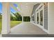 Inviting covered porch with classic columns, a gray wood deck, and ample space for outdoor relaxation at 2552 Scenic S Hwy, Snellville, GA 30078
