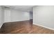 Spacious room with wood floors and neutral walls, offering a versatile area for various uses at 46 Highland Ct, Carrollton, GA 30116