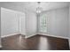 The dining room features wood floors, natural light and chandelier at 46 Highland Ct, Carrollton, GA 30116