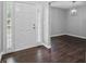 Welcoming entryway featuring wood floors and a modern chandelier at 46 Highland Ct, Carrollton, GA 30116