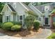 Charming home featuring mature landscaping and a covered front porch at 46 Highland Ct, Carrollton, GA 30116