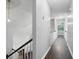 Bright hallway with wood floors, leading to a well-lit room with view outside at 46 Highland Ct, Carrollton, GA 30116