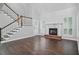 The living room features wood floors, fireplace and staircase at 46 Highland Ct, Carrollton, GA 30116