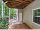 Covered patio area with white door and view of backyard at 46 Highland Ct, Carrollton, GA 30116