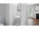Small powder room with pedestal sink and neutral colors at 46 Highland Ct, Carrollton, GA 30116