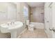 Tiled bathroom featuring a white sink, toilet and shower-tub combo at 6071 Cristie Dr, Ellenwood, GA 30294