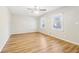 Light filled bedroom features wood flooring, neutral walls, ceiling fan and double window at 6071 Cristie Dr, Ellenwood, GA 30294