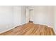 An empty bedroom with wood-look floors and bright white trim at 6071 Cristie Dr, Ellenwood, GA 30294