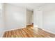 Bedroom with wood-look floors, neutral paint, and a closet at 6071 Cristie Dr, Ellenwood, GA 30294