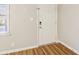 Bright entryway featuring a white front door, wood-look flooring, and a window for natural light at 6071 Cristie Dr, Ellenwood, GA 30294