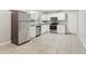 Modern kitchen with stainless steel appliances, white cabinetry, and granite countertops at 6071 Cristie Dr, Ellenwood, GA 30294