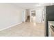 Open kitchen area with stainless steel appliances, tile floor, and a staircase view at 6071 Cristie Dr, Ellenwood, GA 30294