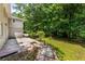 Spacious backyard with a mix of lawn, shrubs, and trees offering a private setting at 1364 Willis Mill Sw Rd, Atlanta, GA 30311