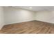Finished basement area with wood flooring, white trim, and natural lighting at 1364 Willis Mill Sw Rd, Atlanta, GA 30311