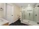 Bathroom featuring black hexagon floors, a glass shower, and neutral walls at 1364 Willis Mill Sw Rd, Atlanta, GA 30311