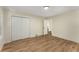 Bright bedroom features wood floors, white trim, closet, and interior access door at 1364 Willis Mill Sw Rd, Atlanta, GA 30311