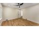 Bedroom featuring wood floors, neutral walls, white trim, a window, and a ceiling fan at 1364 Willis Mill Sw Rd, Atlanta, GA 30311