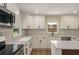 Newly remodeled kitchen featuring quartz countertops, stainless steel appliances, and ample cabinet space at 1364 Willis Mill Sw Rd, Atlanta, GA 30311