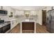 Stunning kitchen with custom cabinetry, a large island, and stainless steel appliances at 1364 Willis Mill Sw Rd, Atlanta, GA 30311