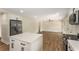 Open kitchen flowing into the living area with stainless steel appliances and granite countertops at 1364 Willis Mill Sw Rd, Atlanta, GA 30311