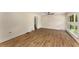 Bright living room featuring hardwood flooring, white trim and expansive windows at 1364 Willis Mill Sw Rd, Atlanta, GA 30311
