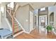 Spacious foyer featuring hardwood floors, staircase and access to other rooms at 2837 Captain Ct, Dacula, GA 30019