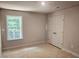 This bedroom includes a window and a double door closet to provide comfort and storage at 309 Melanie Ct, Bowdon, GA 30108