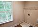 A laundry room offering a great view of the outdoors through a large window at 309 Melanie Ct, Bowdon, GA 30108