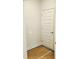 The additional room provides versatile space with an electrical outlet and a six panel door at 309 Melanie Ct, Bowdon, GA 30108