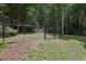 Backyard with black chain-link fence and a gate leading to the yard at 159 Cavan Se Way, Mableton, GA 30126