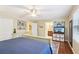 Bedroom with a neutral palette, hardwood floors, a ceiling fan, and ensuite bathroom access at 159 Cavan Se Way, Mableton, GA 30126