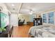 Spacious bedroom featuring hardwood floors, a ceiling fan, and a dedicated office area for work or study at 159 Cavan Se Way, Mableton, GA 30126