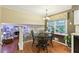 Sunny dining nook adjacent to kitchen, offering a view of the living room and backyard through large window at 159 Cavan Se Way, Mableton, GA 30126