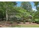 Charming home with mature trees, stone path, and well-maintained landscaping enhances its curb appeal at 159 Cavan Se Way, Mableton, GA 30126