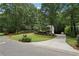 Well-manicured front yard showcases a lovely home with a curved driveway at 159 Cavan Se Way, Mableton, GA 30126