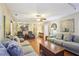 Spacious living room with a comfortable seating arrangement, hardwood floors, and an open layout perfect for relaxation at 159 Cavan Se Way, Mableton, GA 30126