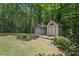 Two backyard sheds surrounded by green trees providing ample storage at 159 Cavan Se Way, Mableton, GA 30126